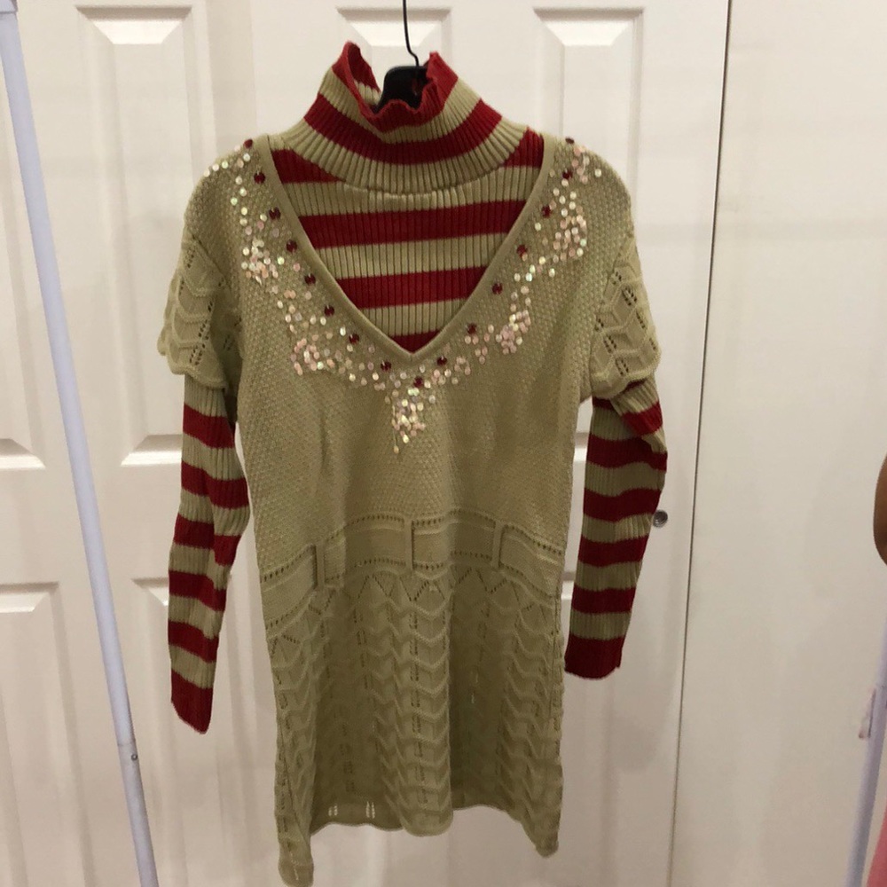 Tan sweater, turtleneck with red stripes